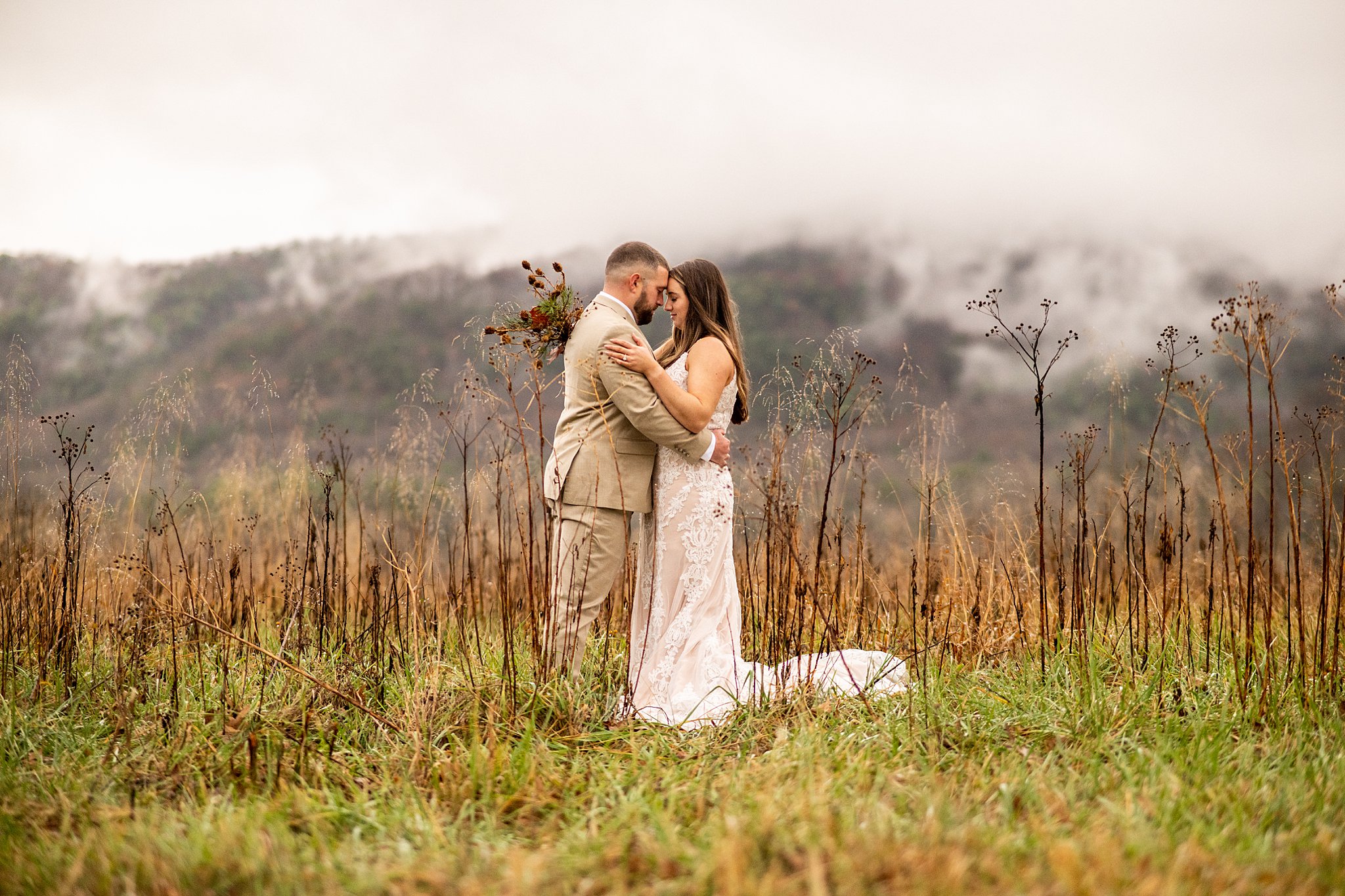 bride and groom in the rain in Cades Cove