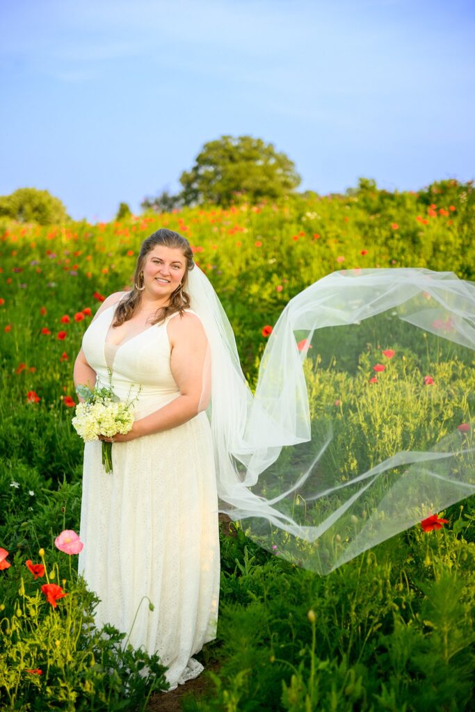 bride in field of flowers