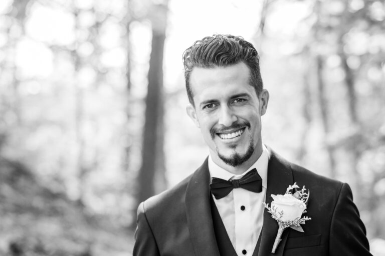 Black and white portrait of a groom on his wedding day in The Great Smoky Mountains National Park by wedding photographer Tonya Damron Photography